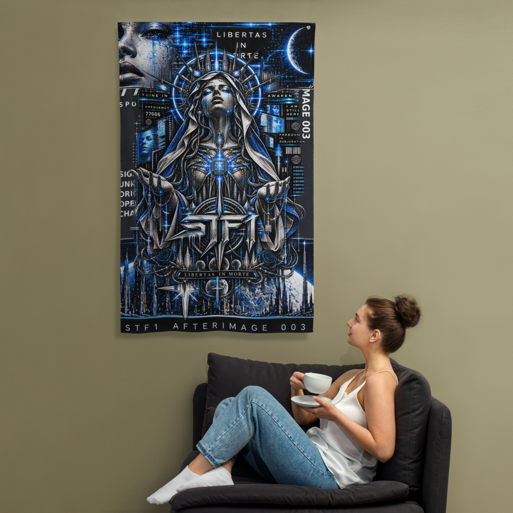 A woman sits in a dark armchair holding a white cup, with a large vertical poster or canvas hanging on the wall above her. The artwork features a blue-toned futuristic female figure with glowing eyes and text including 'STFT' and 'AFTERIMAGE 003'.